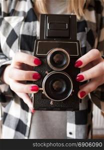 Female Holding a Vintage Camera