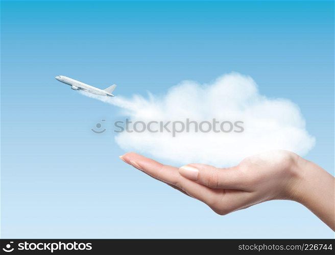 Female holding clounds in hands from which plane taking off into air. Business concept.. Woman holding cloud with plane taking off