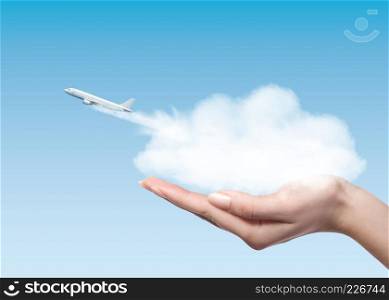 Female holding clounds in hands from which plane taking off into air. Business concept.. Woman holding cloud with plane taking off