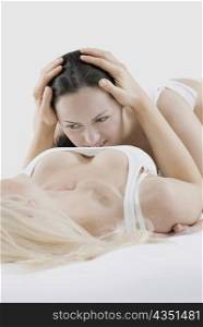 Female homosexual couple doing sexual activity
