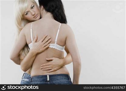 Female homosexual couple embracing each other