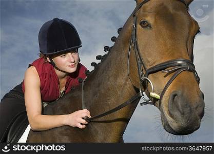 Female horseback holding bridle