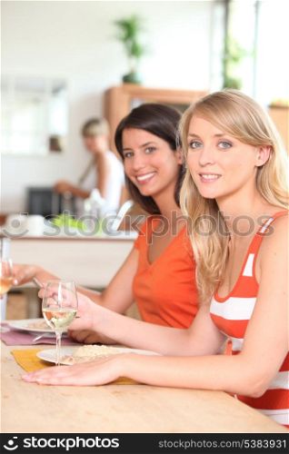 Female housemates eating together