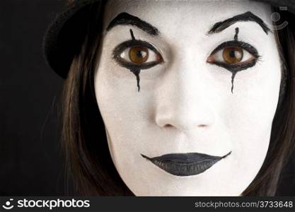 Female in White Face Playing a Clown or Mime Close Up Portrait
