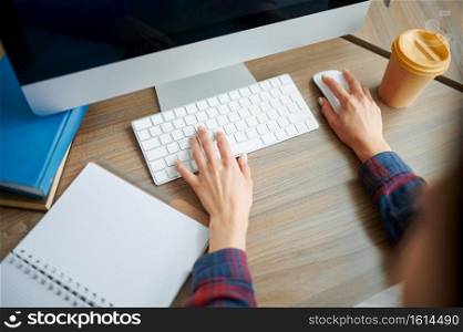 Female IT specialist hands on keyboard in office. Web programmer or designer at workplace, creative occupation. Modern information technology, corporate team. Female IT specialist hands on keyboard in office