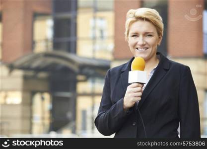 Female Journalist Broadcasting Outside Office Building