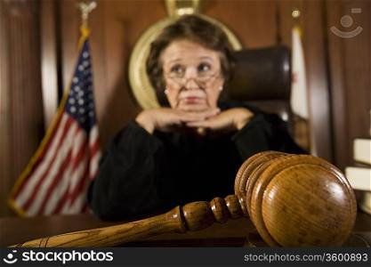 Female judge pondering over sentence