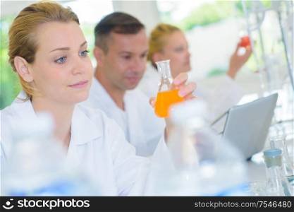 Female lab technician with dreamy expression