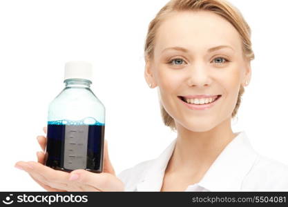 female lab worker holding up bottle with blue liquid