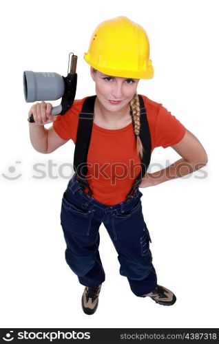 Female laborer holding blowtorch