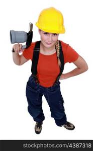 Female laborer holding blowtorch