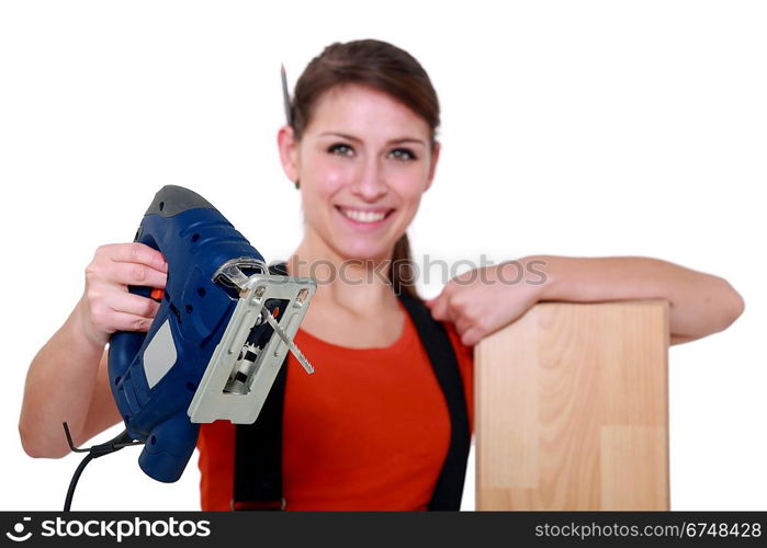 Female labourer holding band saw