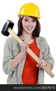 Female labouror holding sledge hammer