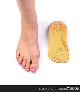female leg standing with orthopedic insole
