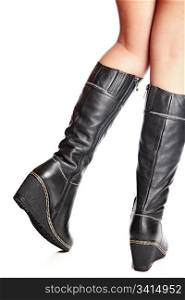 female legs in elegant winter boots