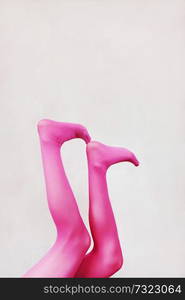 Female legs wearing pink tights