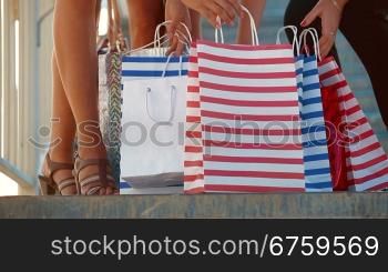 Female legs with shopping bags