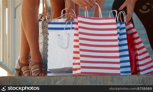 Female legs with shopping bags