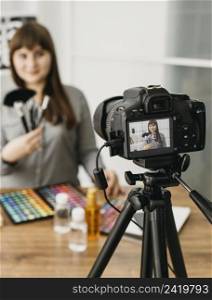 female make up blogger with streaming with camera