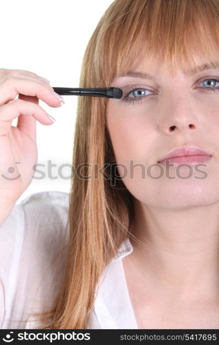 Female making up eyes