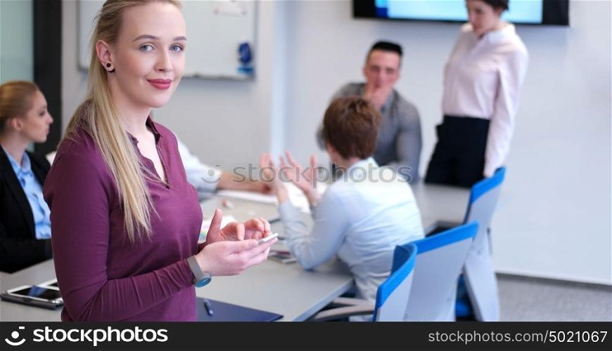female manager using cell telephone in office interior