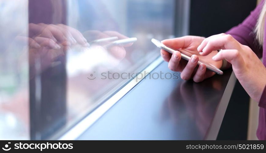 female manager using cell telephone in office interior