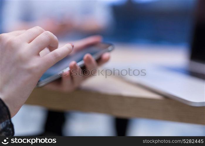 female manager using cell telephone in startup office interior