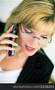 Female Manger talking on the cell phone (very shallow depth of field)