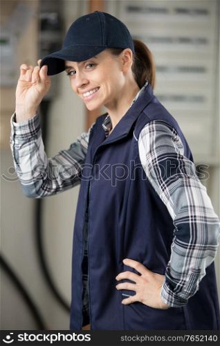 female manual worker tipping her hat in greeting