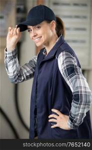 female manual worker tipping her hat in greeting