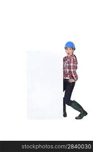 Female manual worker with blank advertisement
