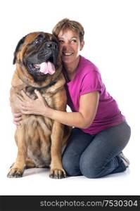 female mastiff and woman in front of white background