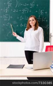 Female math teacher in the classroom 