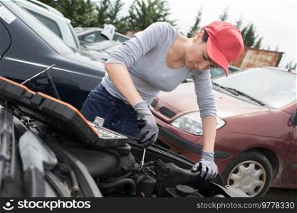 female mechanic is checking her car