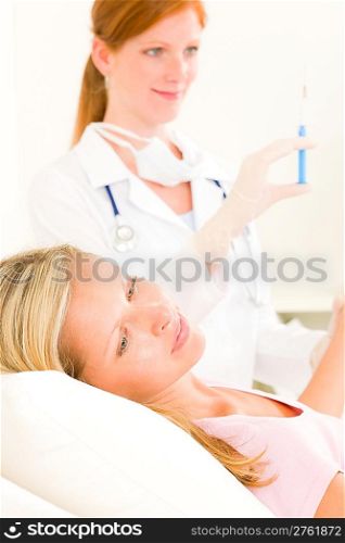 Female medical doctor apply injection woman patient