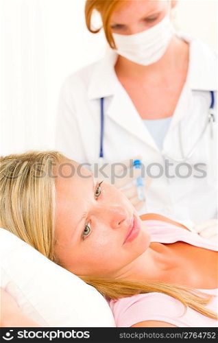 Female medical doctor apply injection woman patient