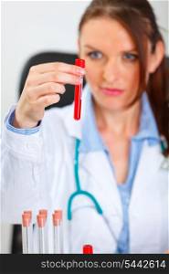 Female medical doctor holding test tube in laboratory&#xA;