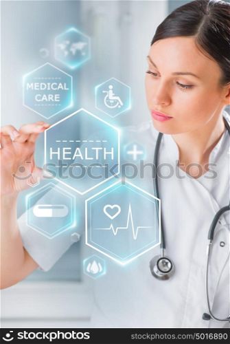 Female medical doctor working with healthcare icons. Modern medical technologies concept
