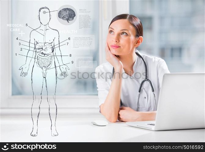 Female medical doctor working with virtual interface examining human male body