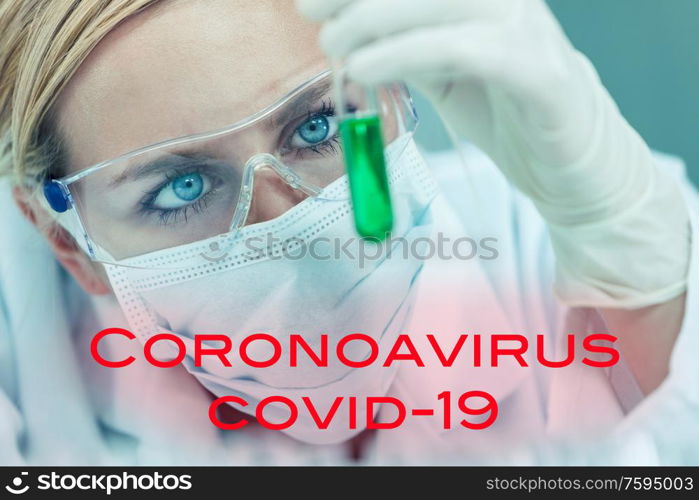 Female medical or research scientist or woman doctor looking at a test tube of in a Coronavirus COVID-19 vacine lab or laboratory with text