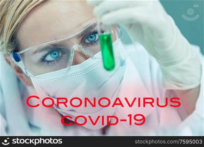 Female medical or research scientist or woman doctor looking at a test tube of in a Coronavirus COVID-19 vacine lab or laboratory with text