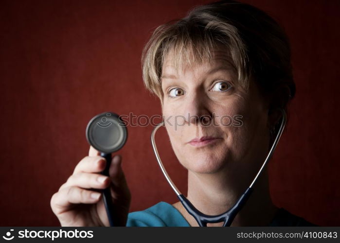 Female medical professional in scrubs with stethoscope