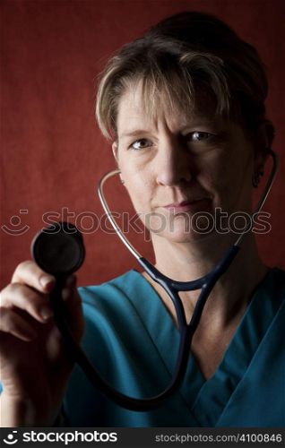 Female medical professional in scrubs with stethoscope