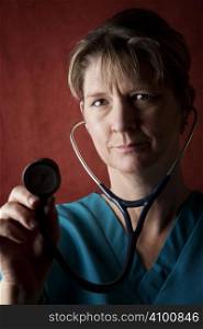 Female medical professional in scrubs with stethoscope