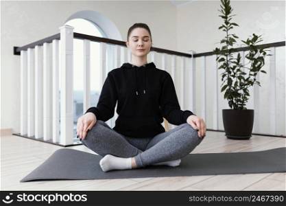 female meditating indoor 6