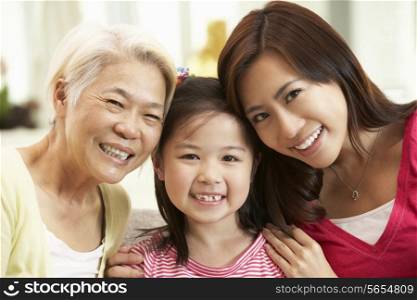 Female Multi Genenration Chinese Family Group Relaxing At HomeTogether