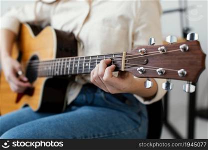 female musician playing acoustic guitar. High resolution photo. female musician playing acoustic guitar. High quality photo