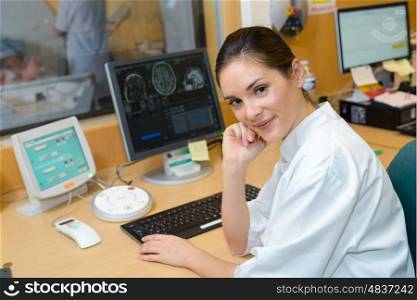 Female nurse analysing scan imagery
