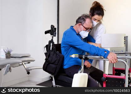 female nurse caregiver, holding patient hand, support disabled patient sit on wheelchair at hospital, young doctor carer help paralyzed patient. High quality photo. female nurse caregiver, holding patient hand, support disabled patient sit on wheelchair at hospital, young doctor carer help paralyzed patient.