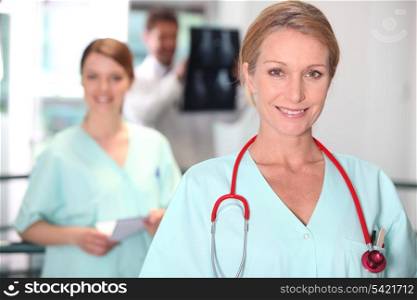 Female nurse in X-ray room.